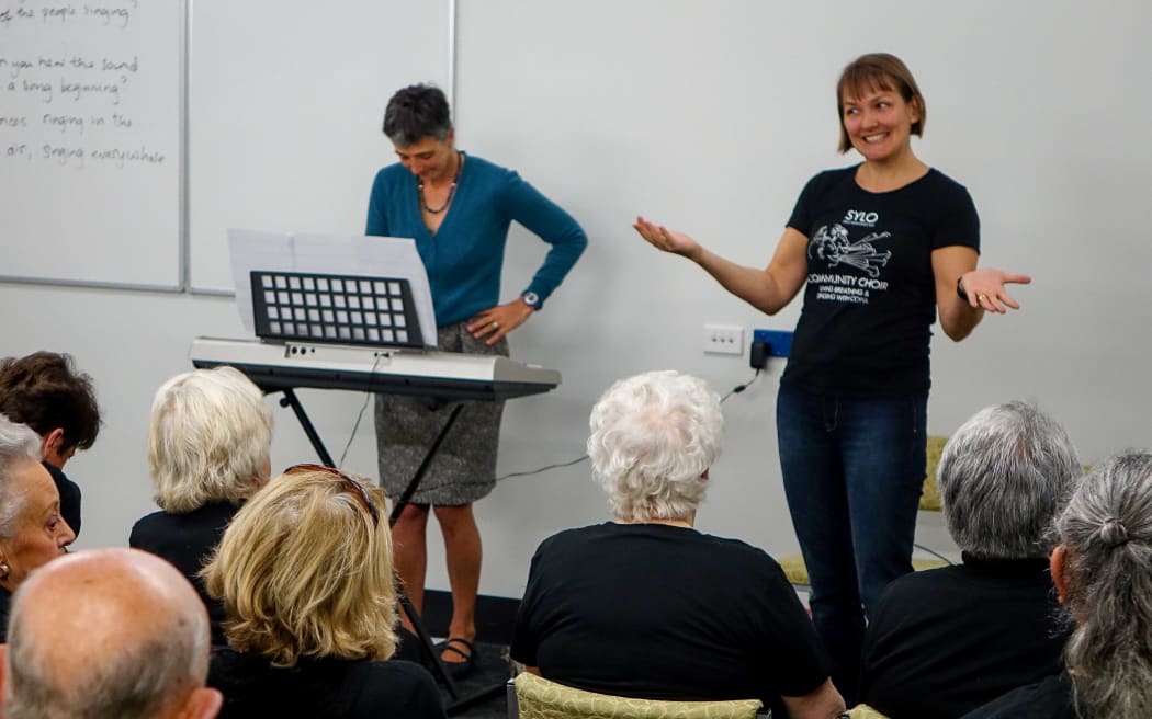 Sing Your Lungs Out choir leader Ruth Collingwood (right)