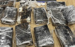 More than 75 packages of cocaine wrapped in cellophane were located in bags.