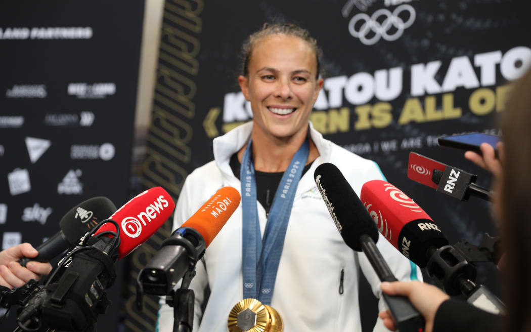 Olympic athletes including Dame Lisa Carrington have arrived at Auckland International Airport from Paris on August 14.