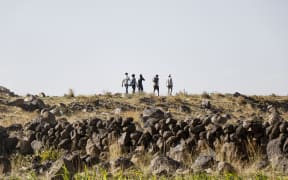 Ethiopian migrants Caption: Ethiopian migrants who are seeking political asylum or just a better life walk along a highway to Saadah province to cross into Saudi Arabia, on August 23, 2023 on the outskirts of Sana'a, Yemen. Mandatory Credit: Mohammed Hamoud/Getty Images via CNN Newsource