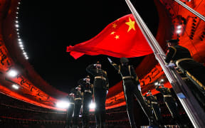 The Chinese national flag is raised during the opening ceremony of the Beijing 2022 Olympic Winter Games at the National Stadium in Beijing, capital of China, 4 February 2022.