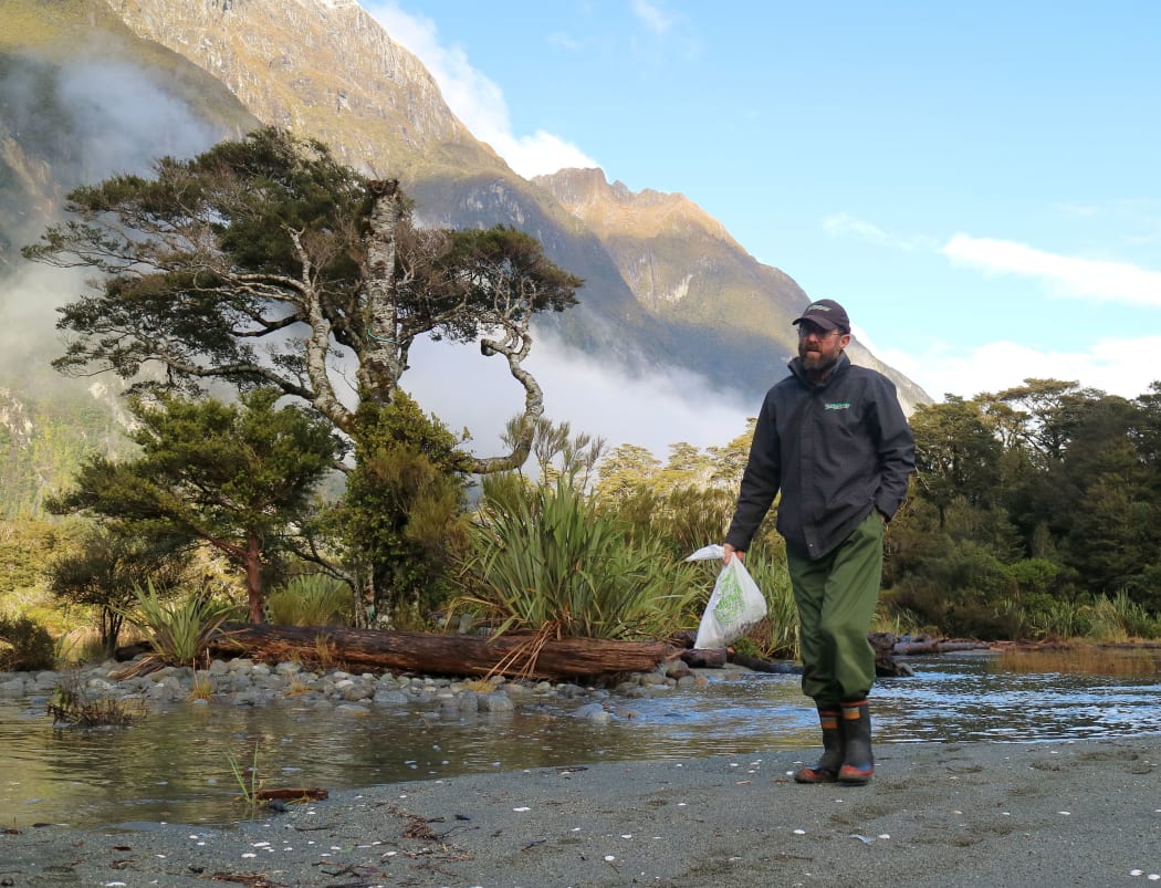 Bruce Fraser collecting rubbish around Milford Sound