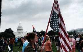 Supporters of those charged in the 6 January attack on the US Capitol attend the Justice for J6 rally on Saturday.