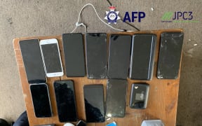 Seized phones as part of raids at multiple properties across Australia.