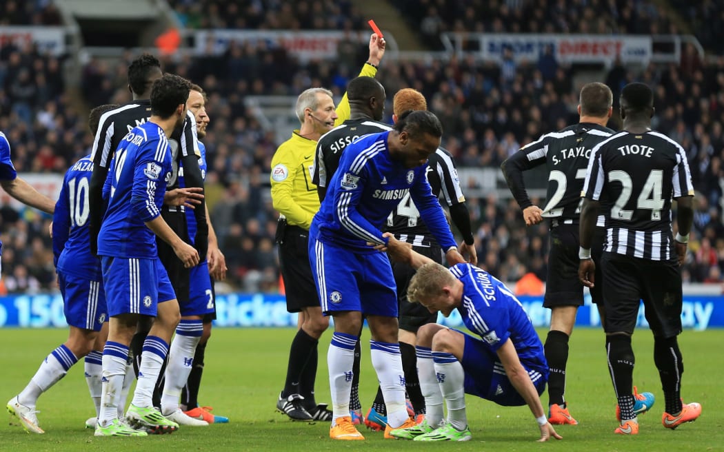 Steven Taylor is sent off while playing for Newcastle United against Chelsea in the English premier league in 2014.