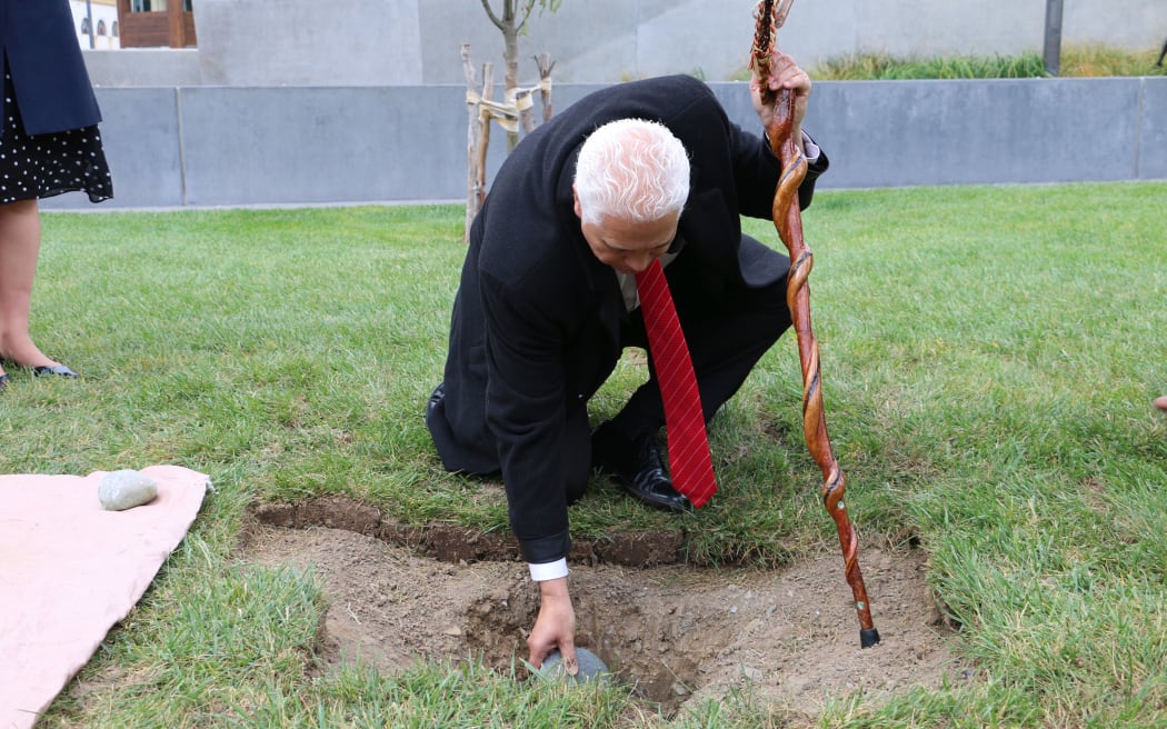 Burying stones at at Pukeahu