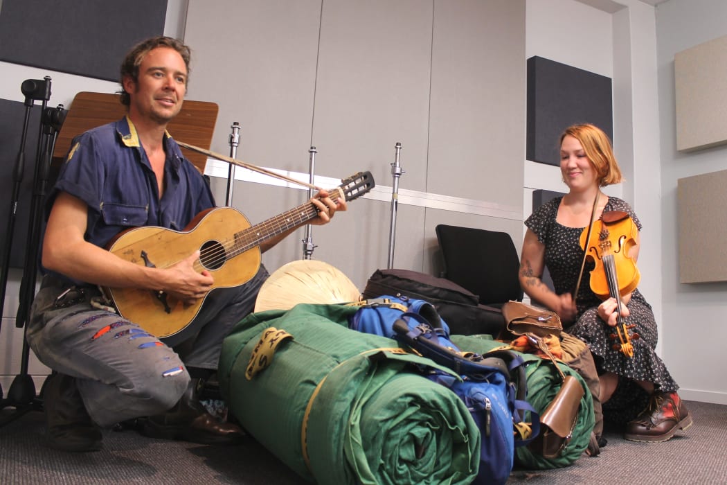 Archer and Flora Knight are hitch hiking around the South Island with their swags and tent, Guitar and Fiddle at the ready.