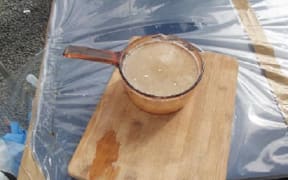The ‘crystallised methamphetamine” located in a glass pot.