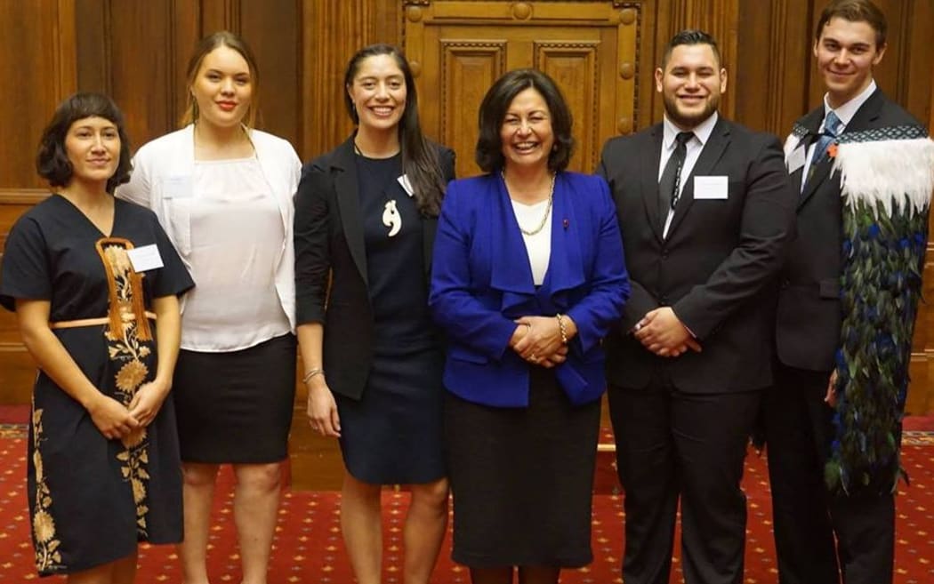 Left to right: Coralie Takuira Dargaville, Hine Kawana, Tahlia Kingi, Hekia Parata, Te Rerekohu Tūterangiwhiu and James Enright (wearing a korowai)