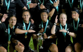 New Zealand's players celebrate their victory on the pitch.