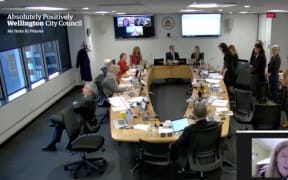 Wellington councillor Sean Rush turns back on group as waiata is sung.