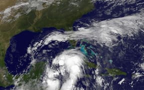 A satellite image shows tropical storm activity along the coast of Central America.