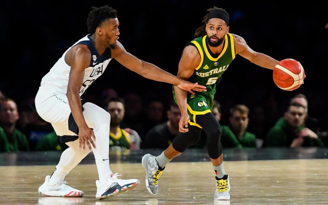 22nd August 2019; Marvel Stadium, Melbourne, Victoria, Australia; International Basketball, United States of America versus Australia Boomers; Patty Mills of Australia dribbles the ball past Donovan Mitchell of USA - Editorial Use Only.