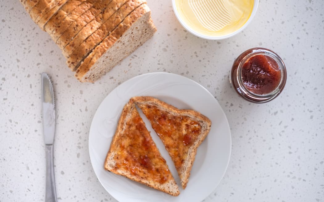 Jam toast on a kitchen bench