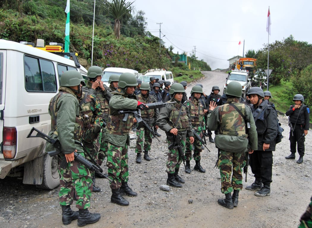 Indonesian soldiers and policemen deployed on the road to the Freeport mine in Papua province.