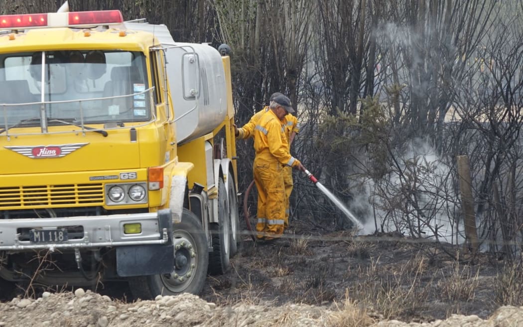 Firefighters dampen hot spots in Rolleston.