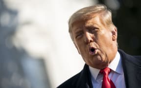 WASHINGTON, DC - JANUARY 12: U.S. President Donald Trump speaks to reporters on the South Lawn of the White House before boarding Marine One on January 12, 2021 in Washington, DC.