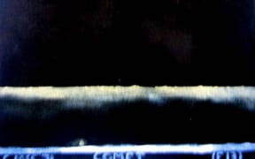 The painting depicts a night scene. Colin McCahon