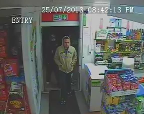 One of the suspects enters the Takanini Liquor Bargain shop on Thursday night.