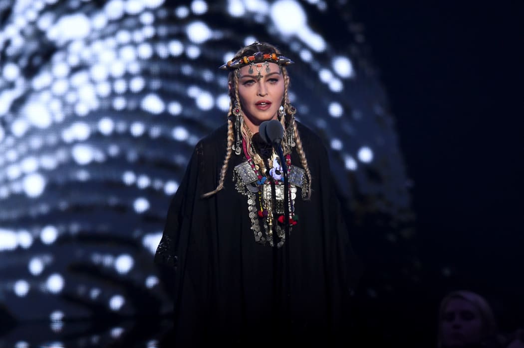 Madonna speaks onstage during the 2018 MTV Video Music Awards