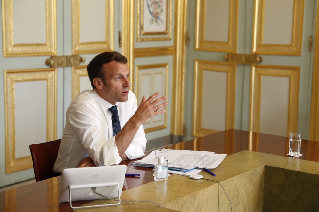 French President Emmanuel Macron attends a video conference call with the president of the Research and Expertise Analysis Committee on ongoing efforts  against COVID-19 in Paris on April 16, 2020.