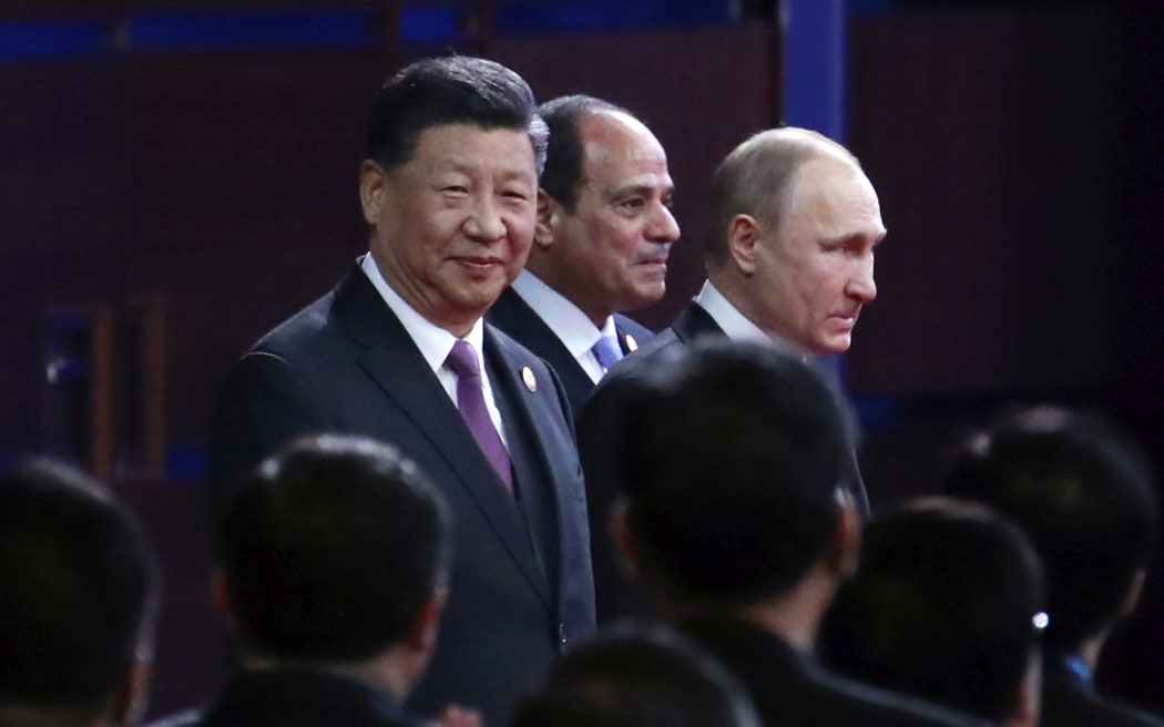 From left, Chinese President Xi Jinping, Egypt's President Abdel-Fattah El-Sisi and Russian President Vladimir Putin arrive for the opening ceremony of the second Belt and Road Forum for International Cooperation (BRF) in Beijing,