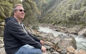 Nik Dirga on the banks of the Yuba River, 2022.