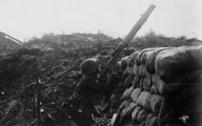 World War 1 New Zealand trench, Gommecourt, France, 10 August, 1918. An unidentified soldier is firing at an enemy aeroplane.
