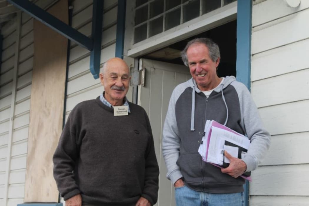 This is an image of Duncan Sutherland and Jeff Griggs outside