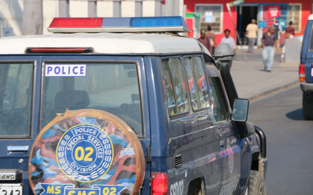A police landcruiser patrols the streets of the Papua New Guinea capital Port Moresby.