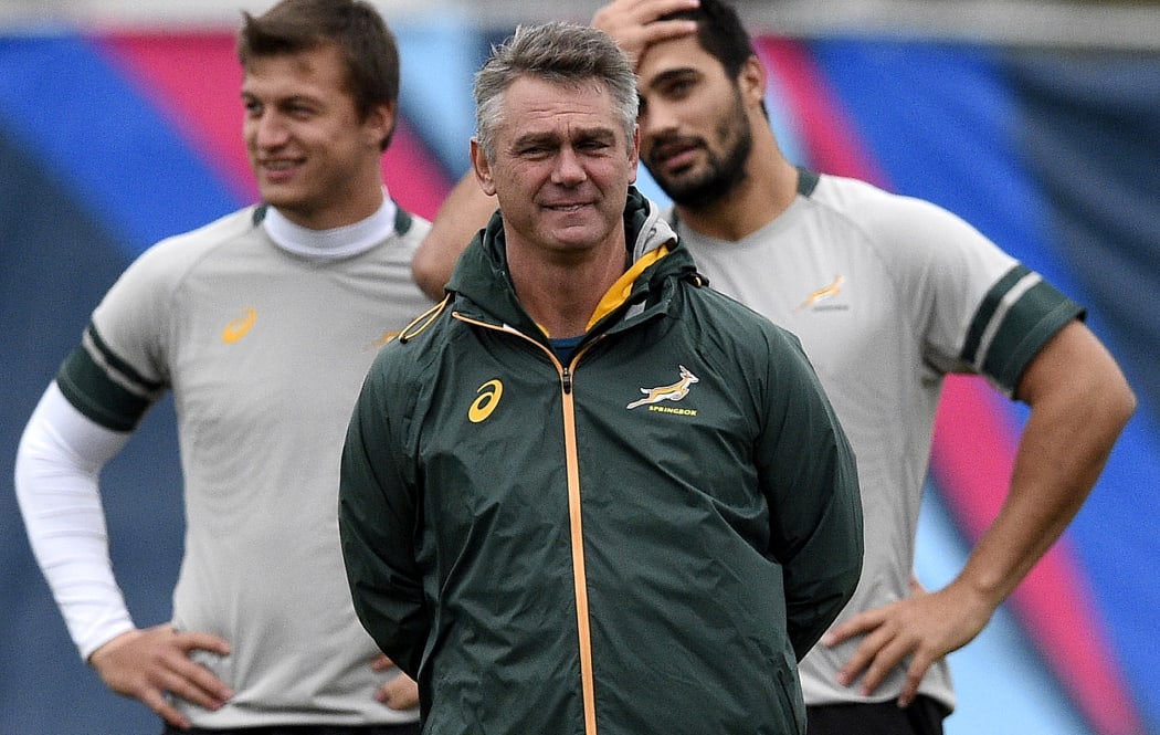 South Africa's head coach Heyneke Meyer (Foreground) is pictured during a team training session at the Surrey Sports Park in Guildford, south east England on October 21, 2015, during the 2015 Rugby World Cup