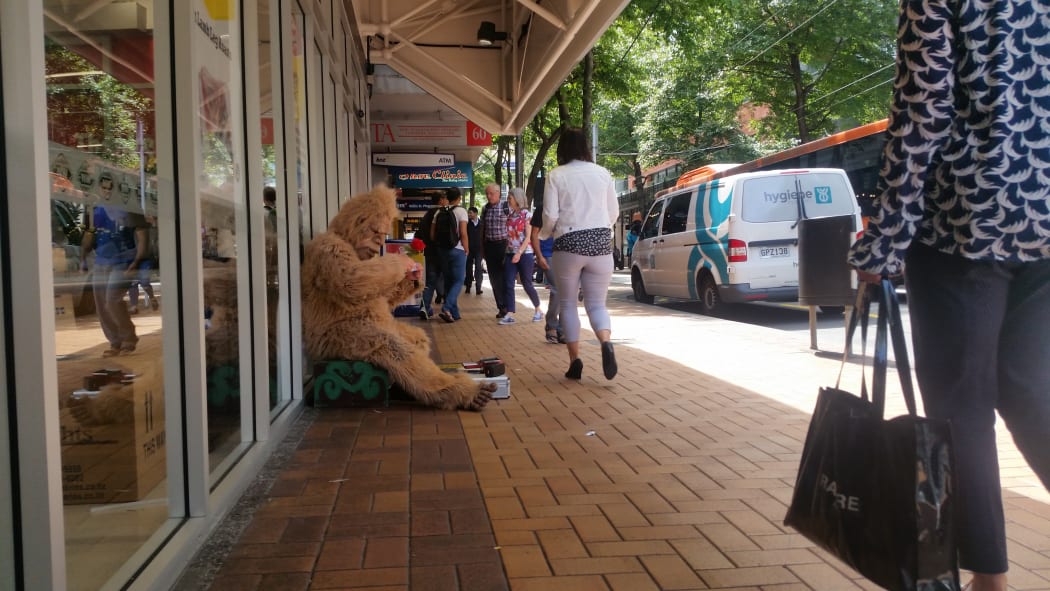 A person dressed as a gorilla begging in Wellington.