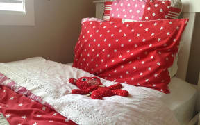 A wheat bag on a child's bed