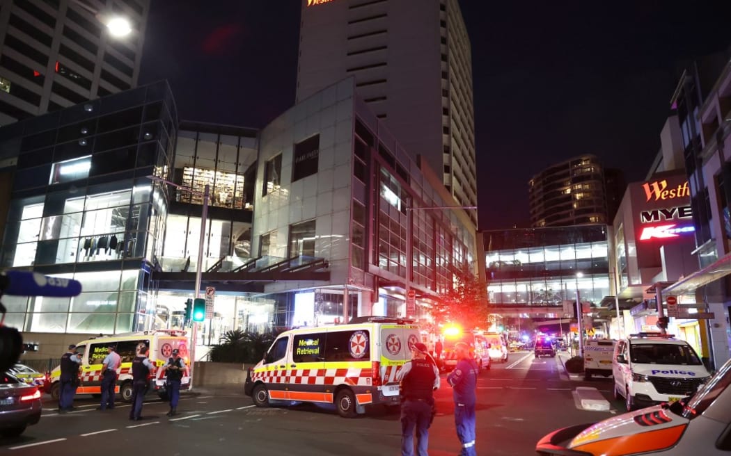 Police block the main roads leading to the Westfield Bondi Junction shopping mall after a stabbing incident in Sydney on April 13, 2024. Australian police on April 13 said they had received reports that "multiple people" were stabbed at a busy shopping centre in Sydney. (Photo by DAVID GRAY / AFP)