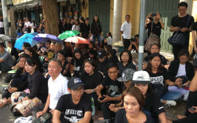 Thousands of people wearing black are seen gathered outside the Grand Palace in Bangkok on October 15, 2016.