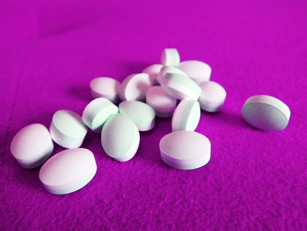 Tablets isolated in a purple background