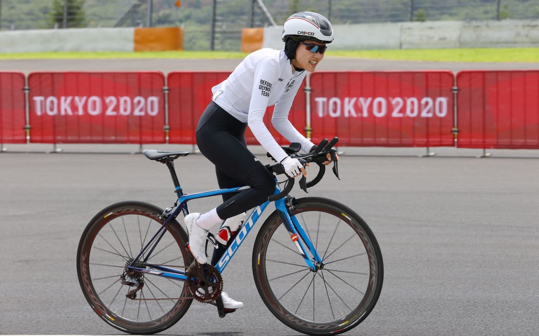 Refugee Olympic Team's Masomah Ali Zada competes in the women's cycling road individual time trial during the Tokyo 2020 Olympic Games