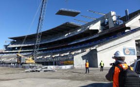 Another roof panel comes off the Paul Kelly stand at Christchurch's Lancaster Park.