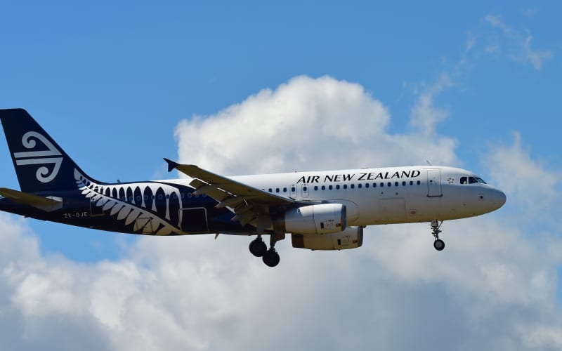 Air New Zealand Airbus A320 landing at Auckland International Airport.
