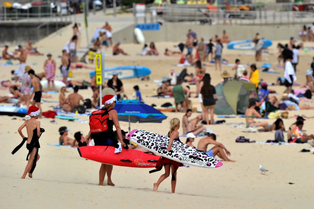 People enjoying Bondi Beach in Sydney on December 22, 2021.