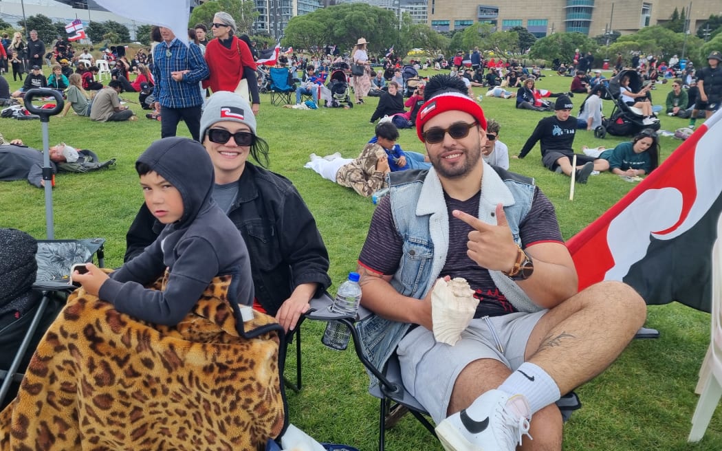 Protesters relax at Waitangi Park after te Hīkoi mō te tiriti reached Parliament.