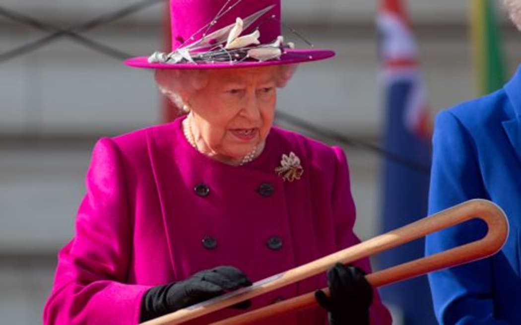 The Queen inspects the Gold Coast baton.