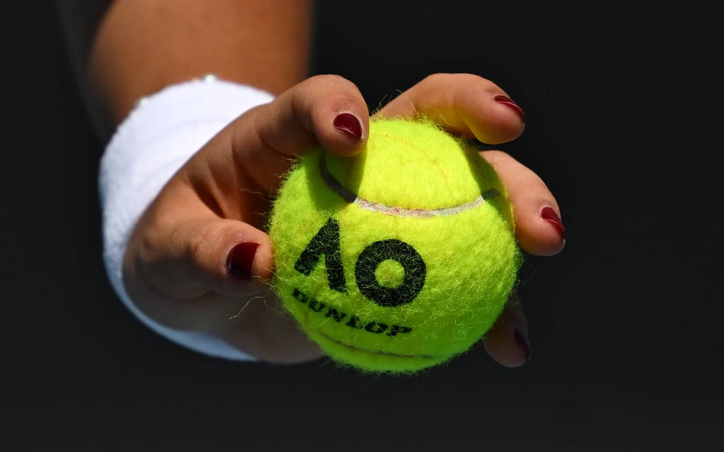 A detail of ball as Emma Raducanu of Great Britain prepares to serve during her round 1 match against Ekaterina Alexandrova of Russia during the 2025 Australian Open at Melbourne Park in Melbourne, Tuesday, January 14, 2025. (AAP Image/Lukas Coch) NO ARCHIVING, EDITORIAL USE ONLY
