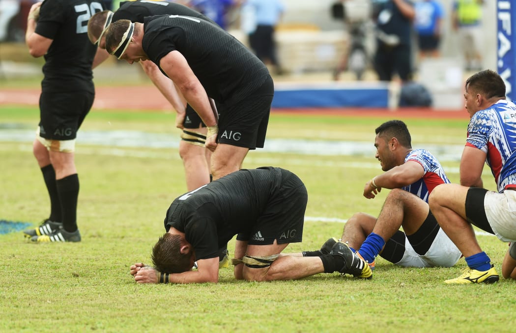 Players from both sides take a moment after the end of the history-making match.