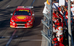 Scott McLaughlin crosses the finish line to win the 2018 Supercars title.