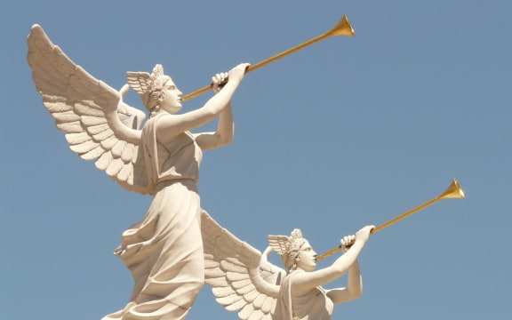 Statues of angels blowing trumpets