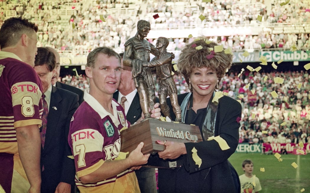 Then Brisbane Broncos captain Allan Langer and Tina Turner with the Winfield Cup trophy in Sydney on 26 September 1993.
