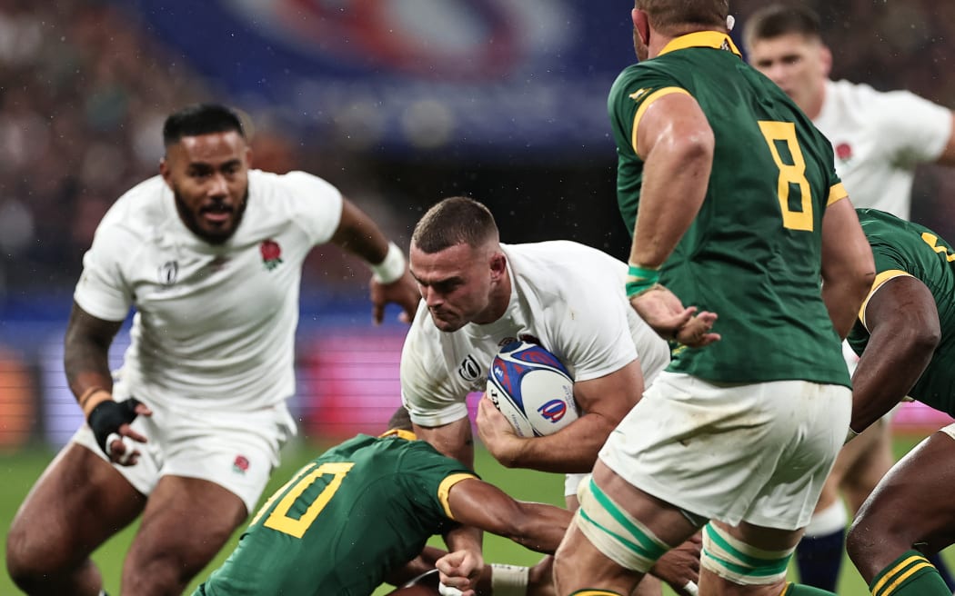 Ben Earl is tackled by Manie Libbok during the 2023 Rugby World Cup semi-final match between England and South Africa at the Stade de France.