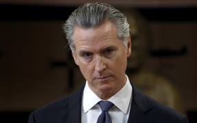 California Gov. Gavin Newsom looks on during a press conference at Friendship House Association of American Indians on January 16, 2026 in San Francisco, California. California Gov. Gavin Newsom joined San Francisco Mayor Daniel Lurie to announce new funding for homelessness and mental health efforts in the city of San Francisco. The governor announced more than $420 million in new state funding for San Francisco, Los Angeles, and San Diego as part of the state's HHAP 6 funding, which goes toward helping local programs end homelessness through interim or permanent housing and supportive services.