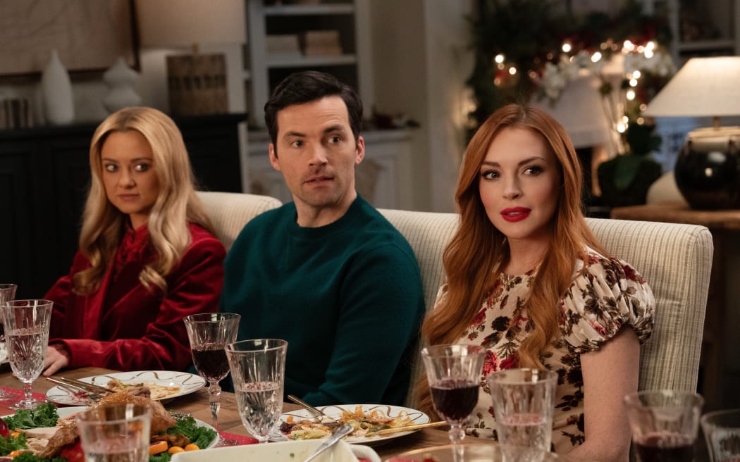 Our Little Secret. (L-R) Katie Baker as Cassie, Ian Harding as Logan and Lindsay Lohan as Avery in Our Little Secret. Cr. Bob Mahoney/Netflix © 2024